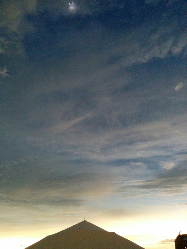 The Nebraska sky during the 2017 Solar Eclipse, with the eclipsed sun at the top of the frame.
